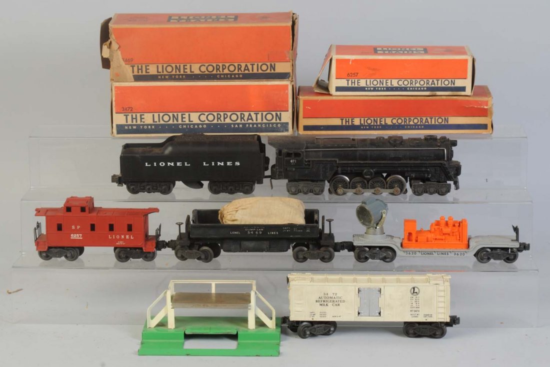 Lionel No.671RR & 4 Assorted Freight Cars.: No.671RR steam locomotive needs cleaning. Cab numbers are worn. No.2671W tender has a reproduction Lionel Lines tender cap. Complete. No.3469 black dump car in original box. Is complete and all origin