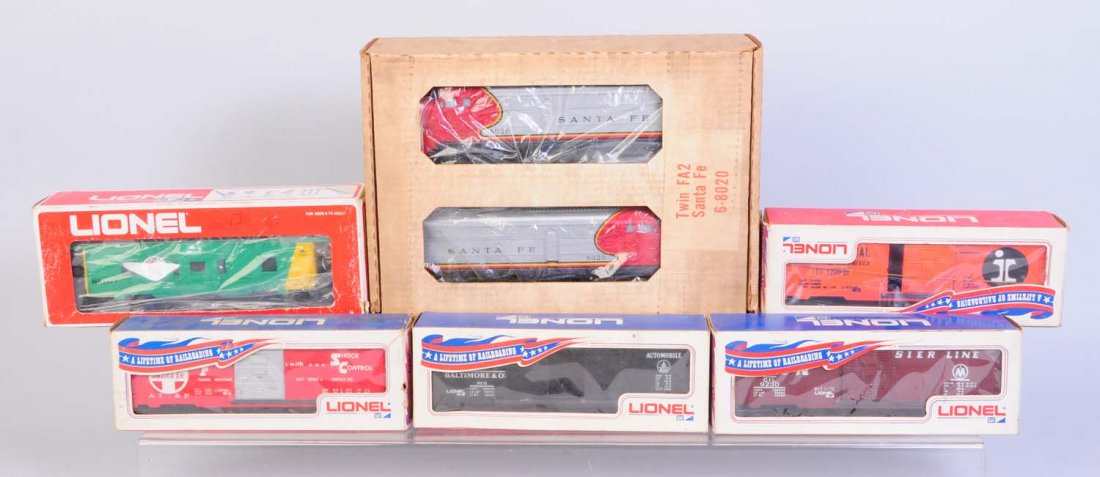 Lionel No.820 Santa Fe Alcos & Freight Cars.: Five freight cars. Modern era. Lionel No.8020 AA both units are complete like new in original box. No.9210 B&O automobile box car. Has some rust on coupler weights otherwise like new condition. No.920
