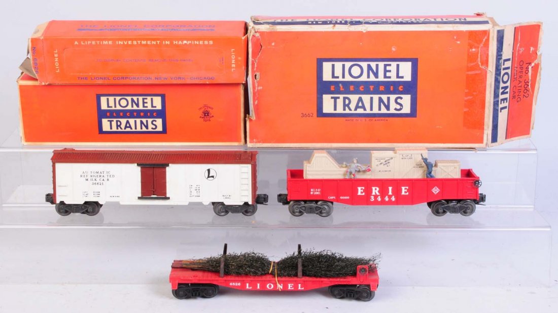 Lot of 3: Freight Cars.: No.6828 flat car with Christmas trees appears to be complete and all original. No.3444 Animated gondola in original box. Complete and all original. Original box has tape repair all along the seam. No.