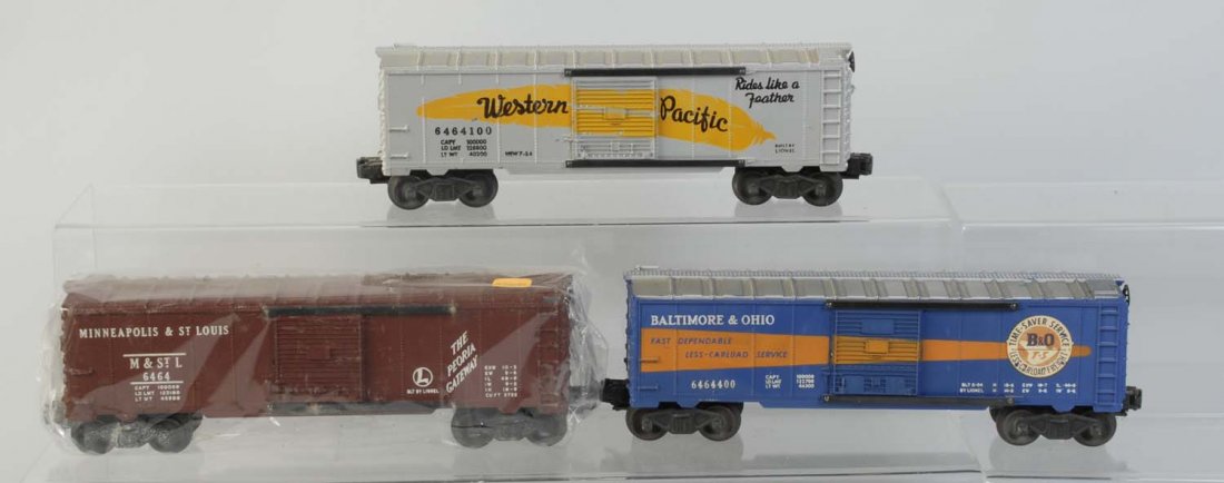 Lot of 3: Lionel Box Cars.: No.6464-400 B&O box car needs cleaning. Has scratches and paint chips mainly on roof. No.6464-100 Western Pacific car is complete and all original. No.6464 brown Minneapolis St. Louis box car. Has som