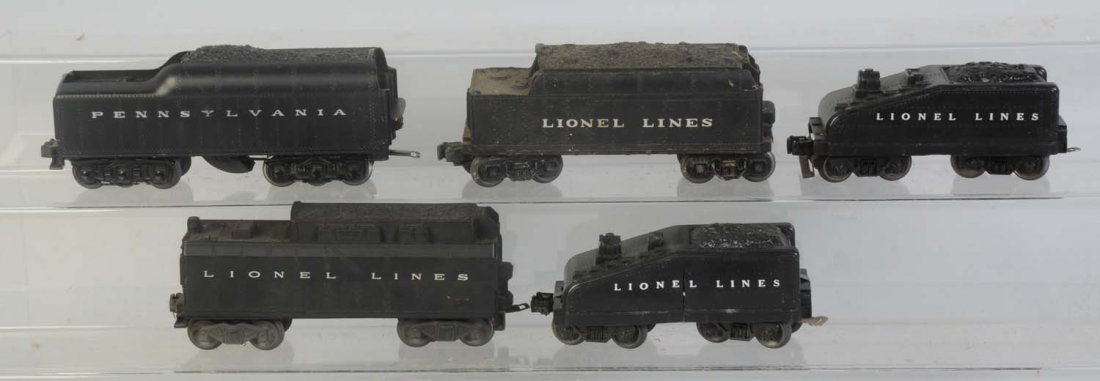 Lot of 5: Assorted Lionel Odd Tenders.: No.2671W whistle tender with Pennsylvania cap. Has some scratches. No.6026W whistle tender Missing The Whistle. Needs cleaning. Tender for No.2034 type steam locomotive needs cleaning. Coal comb is ba