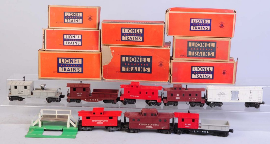 Lot of 8: Lionel Rolling Stock.: Includes No.3462 operating milk car complete and all original. No.3462P milk car platform has some paint chips. Original box is rough. Missing ends. No.2472 PRR caboose. Has coil coupler trucks. Compl