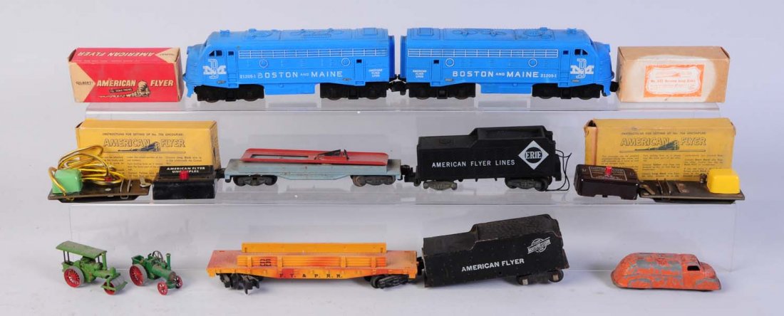 No.21205-1 Boston & Maine Diesels.: Both are non-powered. One is missing both couplers. Both could clean to better grade. Also includes No.65 cannon car, no cannons and missing end railings and brake wheel. Erie American Flyer tender mi