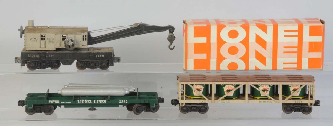 Lionel 2460 Grey Cap Crane, 6475, 3362 Cars.: No.6475 Heinz pickle vat car needs cleaning. Has some rust on wheels and axles. No.2460 grey cab crane. Has corrosion oncontrol wheels and trucks. Incorrect hook. No.3362 Helium flat car. Car is compl