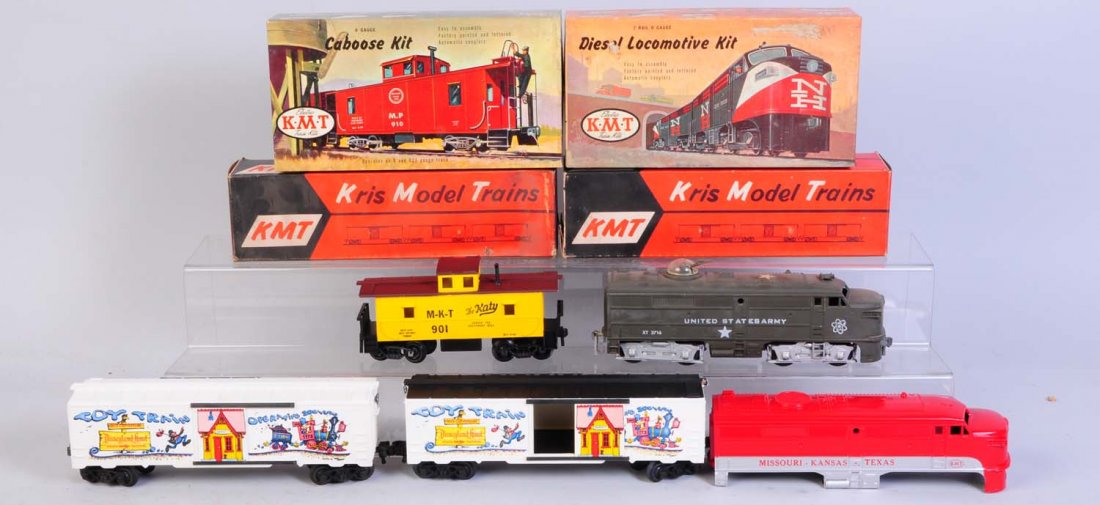 KMT Assortment.: Includes one KMT dummy US Army Alco broken turret guns. KMT MKT Alco power unit kit. Appears new in the original box. KMT MKT caboose like new in original box. KMT TTOS Disneyland box car. Like new in
