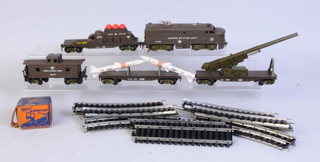 Kusan Military Set with Extras.: Includes one Alco locomotive complete and all original and in excellent condition. One Kusan cannon car complete and all original and in excellent condition. One Atomic reactor car complete and all or