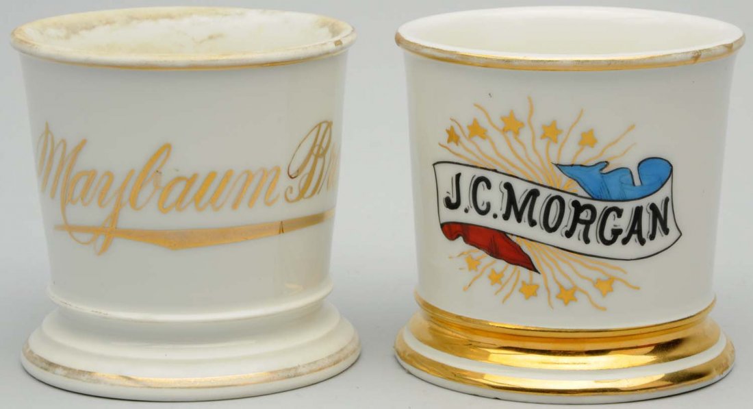 Lot of 2: Name Shaving Mugs.: Includes one with "J.C. Morgan" in gold gilt, with a red, white and blue decoration. Mug is stamped, "T&V Limoges, France". The second mug has "Maybaum Bros." in gold gilt. Mug is stamped, "T&V Limoge