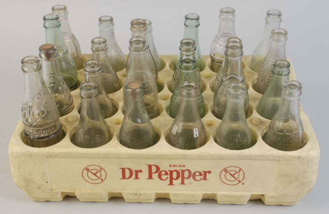 Dr. Pepper Plastic Case with Bottles.: Most bottles are nicely embossed and different with lighter wear. Condition (Excellent). Size 18 - 1/2" x 11 - 3/4".