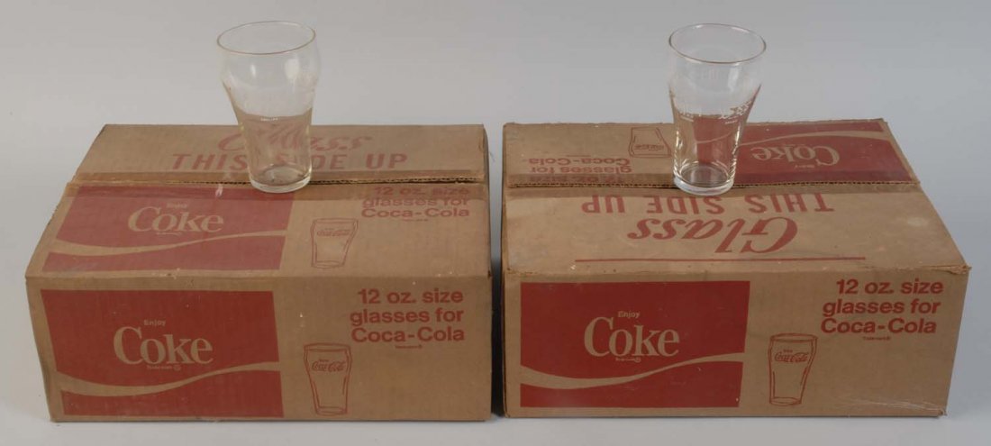 Lot of 2: Boxes of 1970s Coca-Cola Glasses.: Each box has a dozen unused glasses. The boxes themselves have wear and soiling. Condition (Excellent - Near Mint). Size Each Box: 13 - 1/2" x 10 - 1/2".
