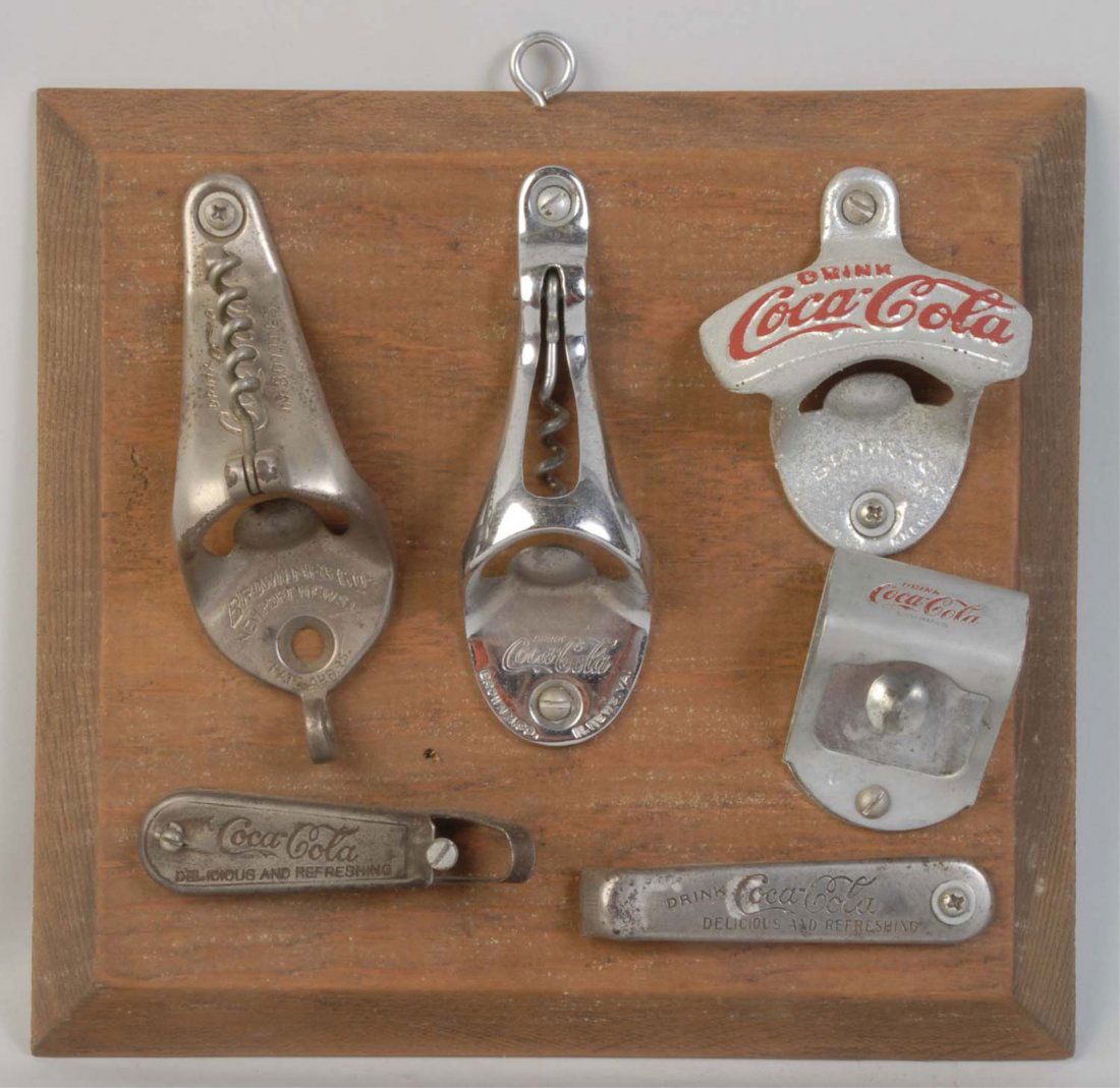 Lot of 6: Coca-Cola Bottle Openers.: 1920s -1960s. Only light to moderate wear on most openers. Condition (Very Good - Near Mint). Size Largest: 5" L.
