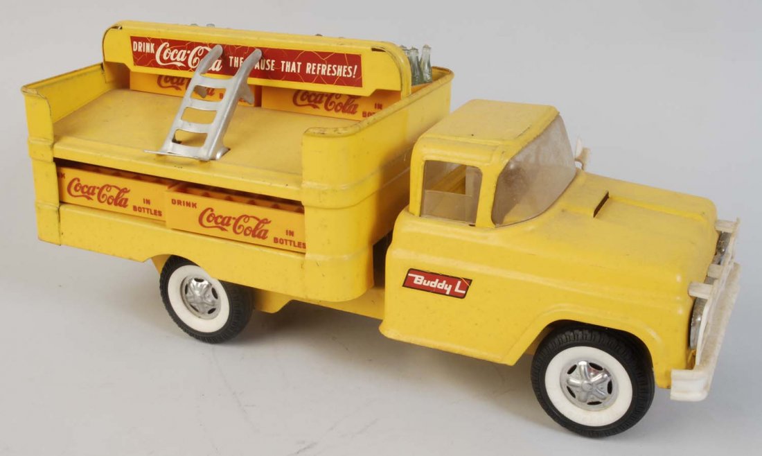 1950s - 60s Buddy L. Toy Truck.: Plastic and metal front bumper with spring loaded front wheels. Heavier soiling with light to little wear. Condition (Very Good). Size 15" L.