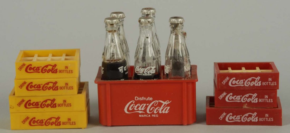 Large lot of Mini Coca-Cola Bottles.: Also includes a few small cases and five miniature glass bottles. Light wear. Condition (Excellent). Size Largest: 3 - 1/4" T.