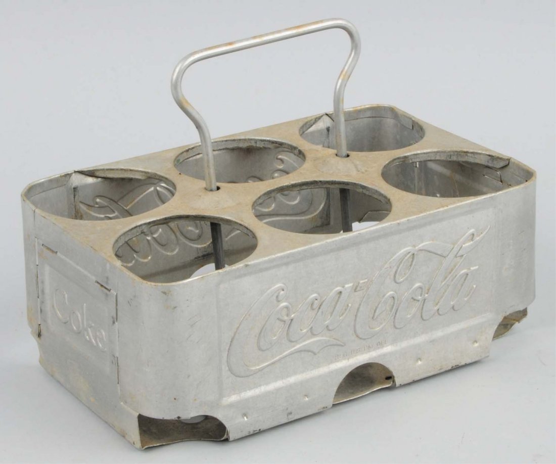 Coca-Cola Aluminum Bottle Carrier.: Light soiling and nearly no wear. Condition (Near Mint). Size 8 - 1/4" L.