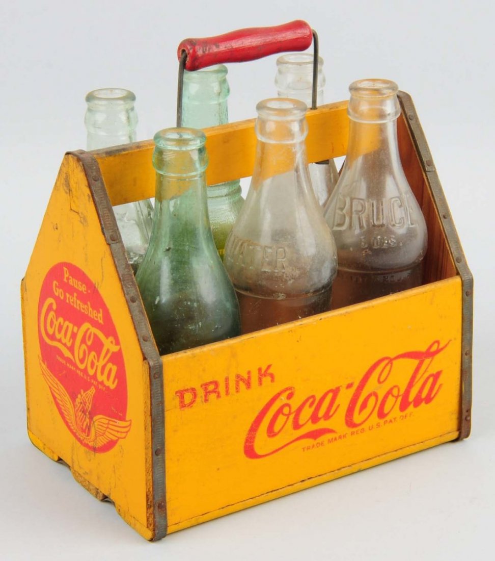 Coca-Cola Wooden Carrier with 6 Bottles.: Very little wear with a few small splits on one end. Condition (Excellent). Size 8 - 1/2" L.