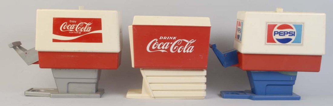 Lot of 3: Plastic Coca-Cola & Pepsi Dispensers.: One Coca-Cola dispenser is incomplete. Only light wear and soiling. Condition (Excellent). Size Largest: 11" T.