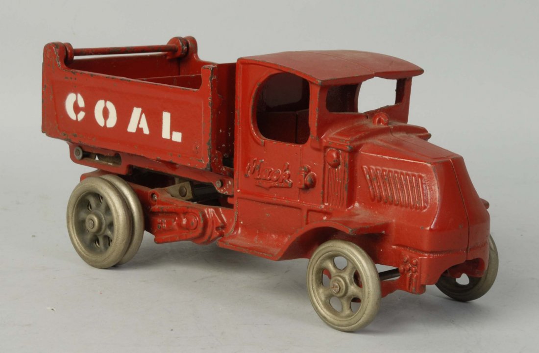 Cast Iron Arcade Coal Mack Front Dump Truck.: Marked coal on both sides of back. Original tailgate. Missing driver. Dual rear wheels. Toy has been completely repainted. Condition (Repainted). Size 10" L.