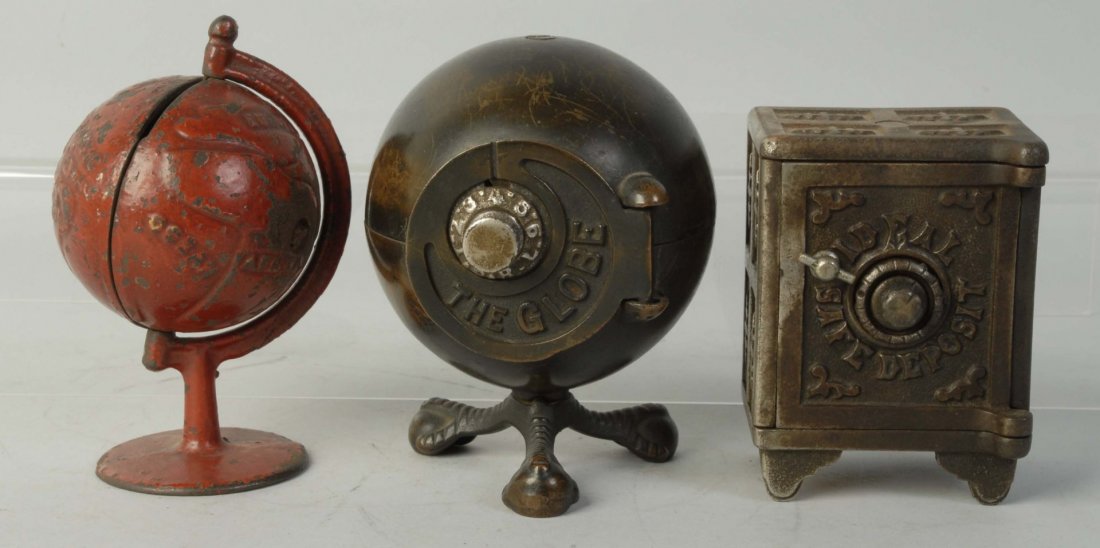 Lot of 3: Cast Iron Still Banks.: Includes two globes and an ideal safe. Condition (Good - Very Good). Size Largest: 5 - 1/4" T.