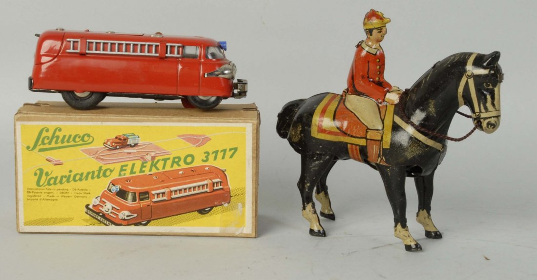 Lot of 2: German Tin Toys.: Wind-up toys. Includes Shucko Electro bus. No. 3117 in original box. Second tin lithographed jockey horse on rider. Condition (Excellent). Size Largest: 5" L.