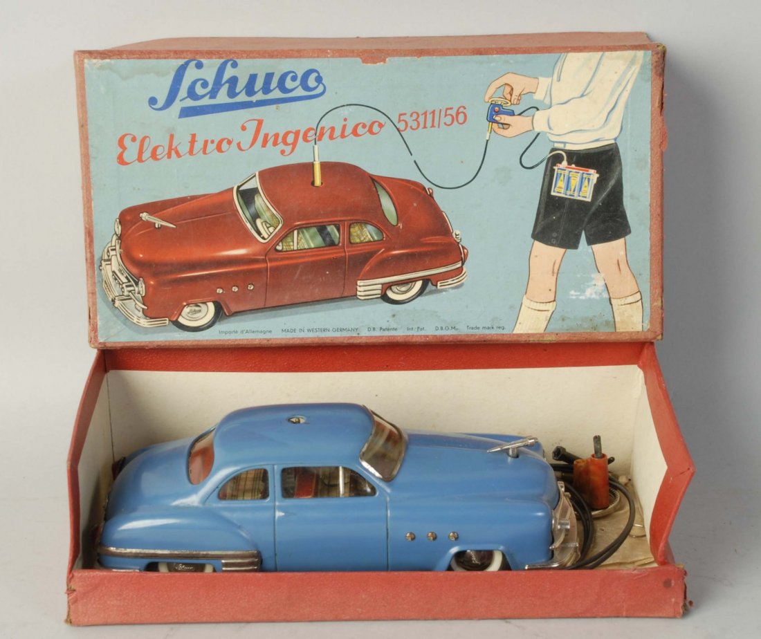 German Schuco Remote 5311/56 Car in Box.: Ingenico automobile toy. Original box includes remote control does include Shuco manual. Car looks fairly complete but might be missing some stop signs and battery holder. Box has some staining. Condi