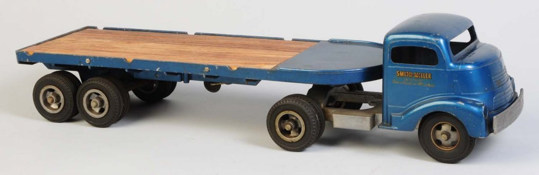Smith-Miller Tractor Trailer Flatbed Truck.: Truck is a cab over model. Looks to be all original. Does have some scratching and wear throughout. Condition (Very Good). Size 24" L.