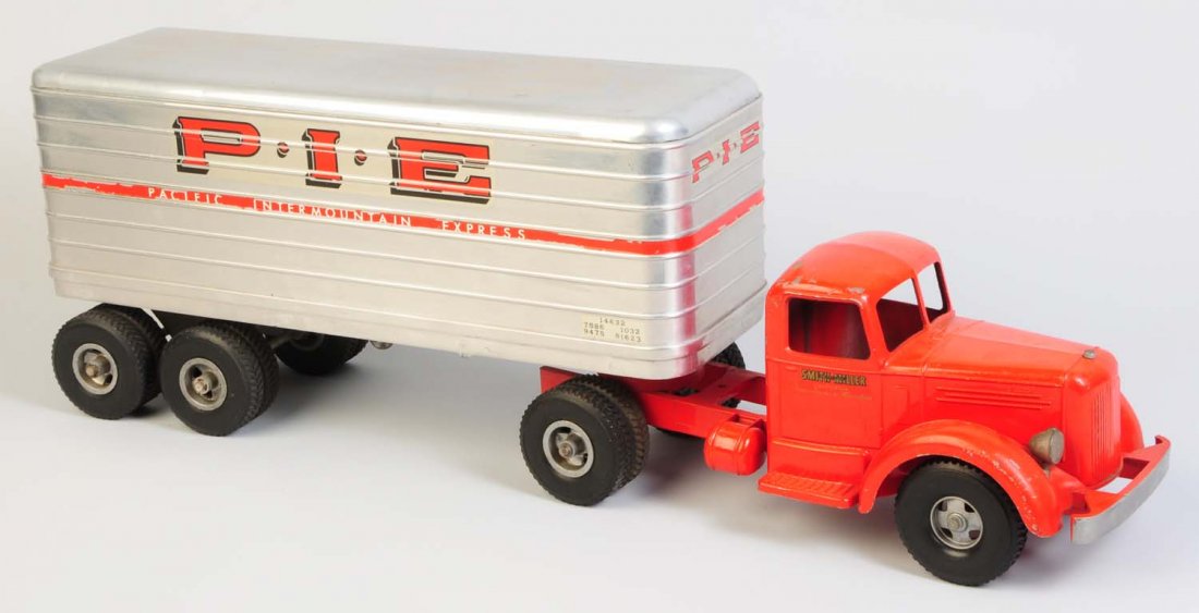 Smith-Miller Pie Pacific Intermountain Express.: Does have the Mack front end. Toy appears to be all original. Front bumper is complete. Trailer does have both rear doors. Does have some chipping and scratching throughout. Condition (Very Good - Exc