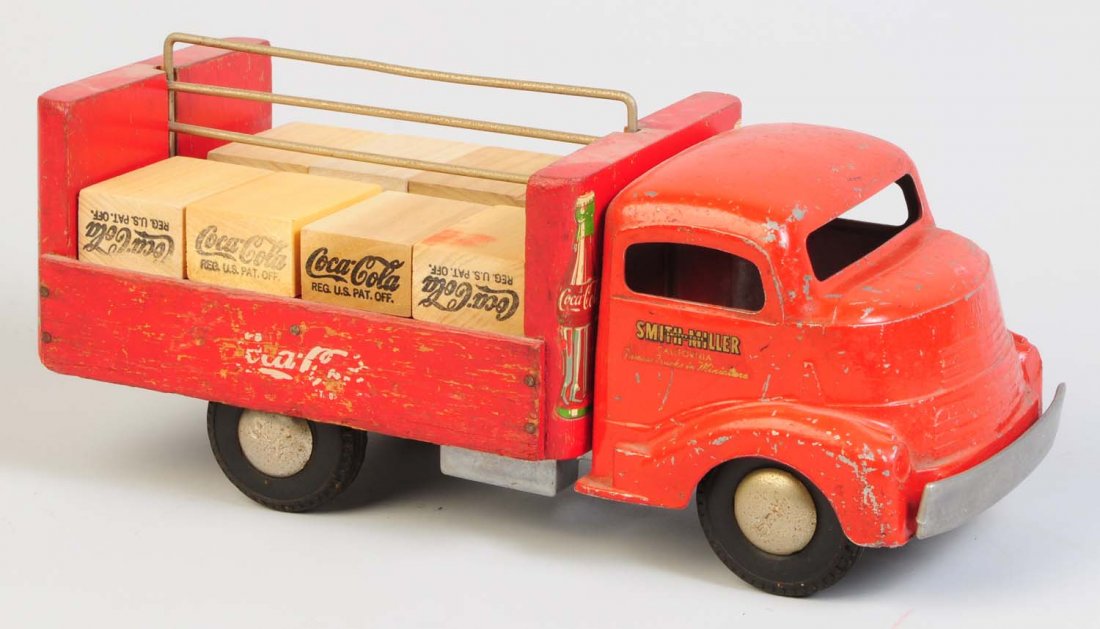 Smith Miller Cab Coca-Cola Delivery Truck.: Truck appears to be all original. Does have significant wear and chipping throughout the truck. Some wear to decals. Does have eight replacement wooden Coca-Cola cases in the back of the truck. Condit