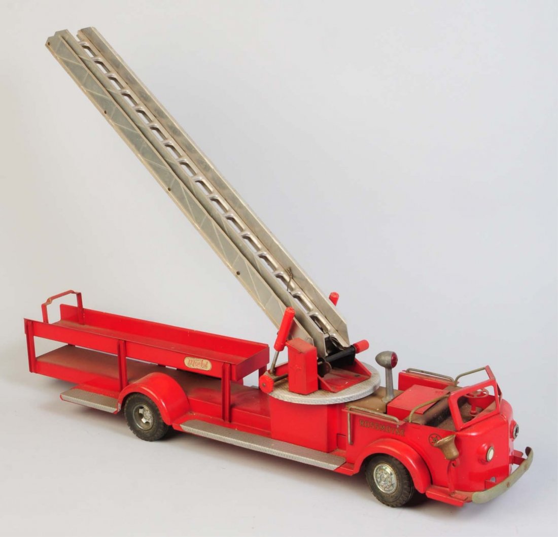 Doepke Pressed Steel Rossmoyne Ladder Truck.: American La' France. Truck is all original. Is missing a side running board and a front headlight insert. Does have some corrosion and scratching throughout. Condition (Good - Very Good). Size 35" L.