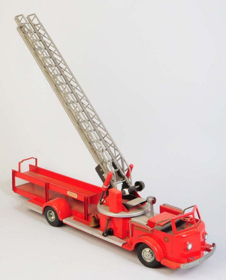 Doekpe Pressed Steel Rossmoyne Ladder Truck.: American La' France. Truck appears to be all original. Is missing the chrome side running board. Does have some slight chipping and scratching throughout. Condition (Very Good - Excellent). Size 35" L