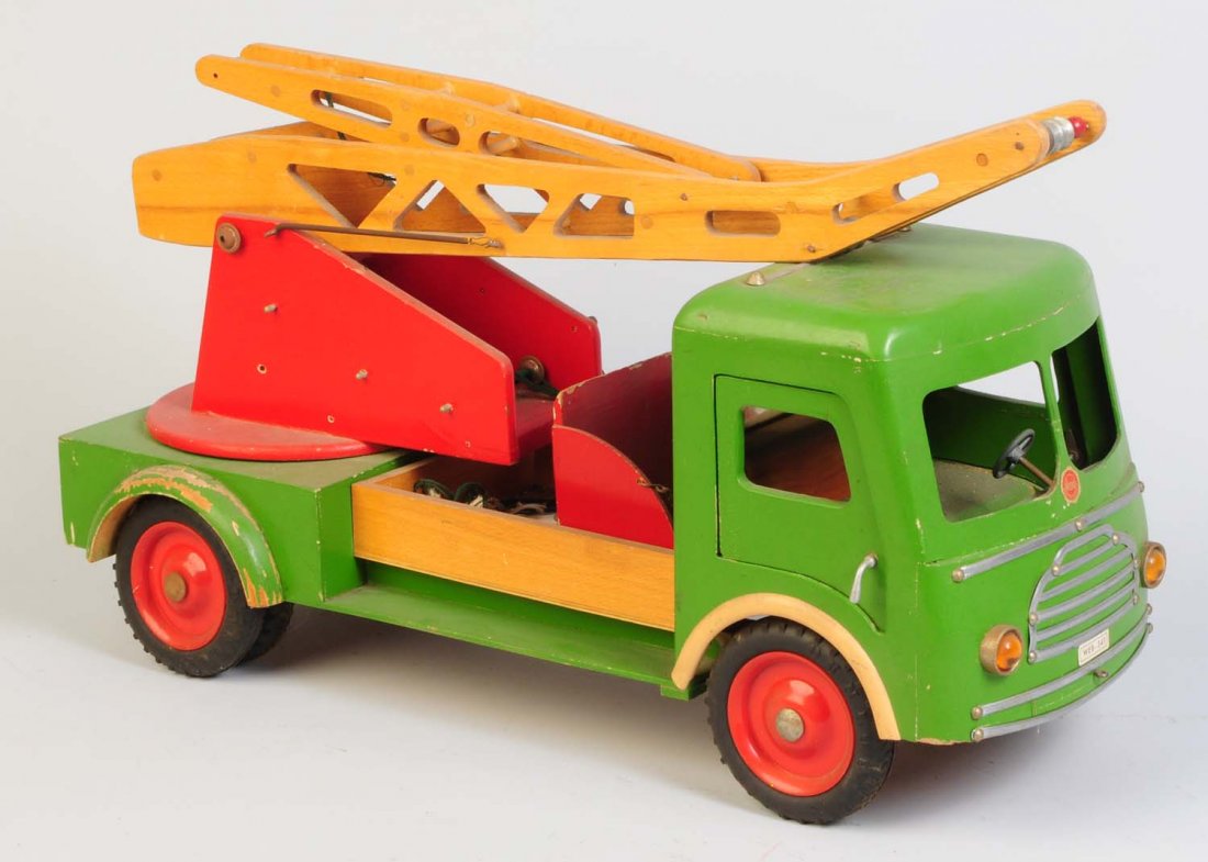 Hedo Wooden Crane Truck.: Large scale truck made in Germany. Truck appears to be all original and complete. Has some significant paint loss to the rear fender. Some scratching and chipping throughout. Condition (Good - Very Go