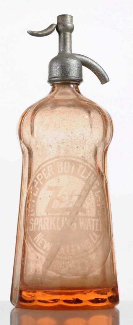 Dr. Pepper Seltzer Bottle.: Pink glass with Dr. Pepper Bottling Co. etched in glass. Early 1900s. Size 12 - 1/2" T.