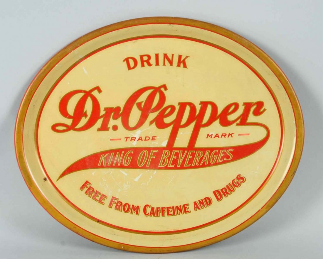 Early Large Dr. Pepper Oval Tin Serving Tray.: 1900-05, with strong color and just a few small stains and light soiling with mild color rubbing in a few small areas. Condition (Excellent). Size 16 - 3/4" L.