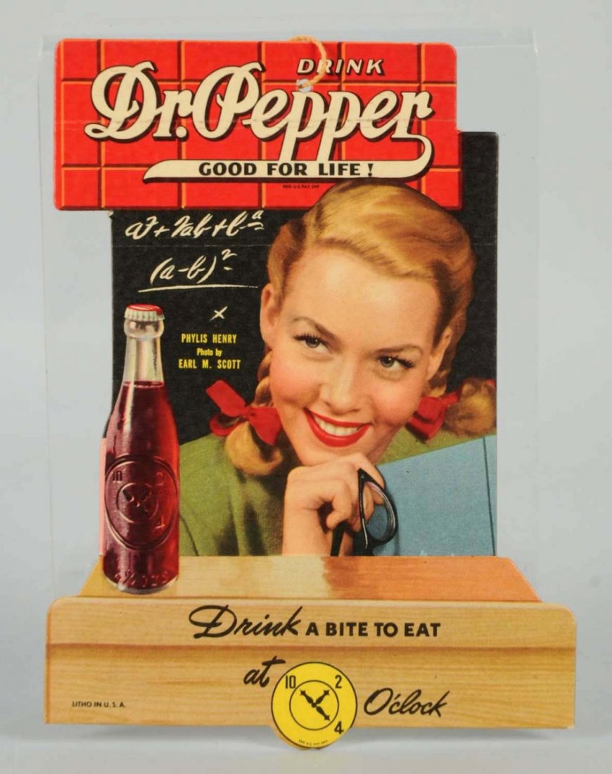 1940s Dr. Pepper Fan Pull Featuring Phylis Henry.: A few faint surface marks on one side and not often found. Condition (Near Mint). Size 6 - 3/4" T.