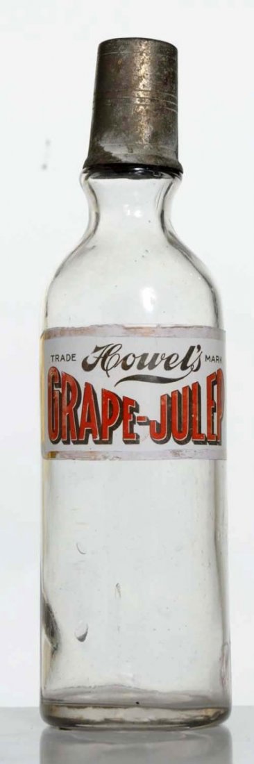 Syrup Bottle, Howell's Grape Julep.: Applied label. C.1910. Condition (Excellent). Size 12 - 1/4" T.