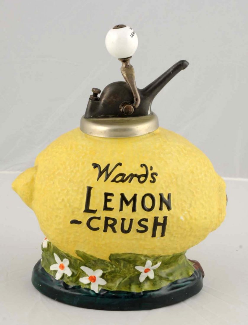Ward's Lemon Crush Syrup Dispenser.: Figural in shape of a lemon, ceramic. Original ball style pump with Ward's Lemon Crush on ball. C.1920. Condition (Near Mint). Size 14" T.