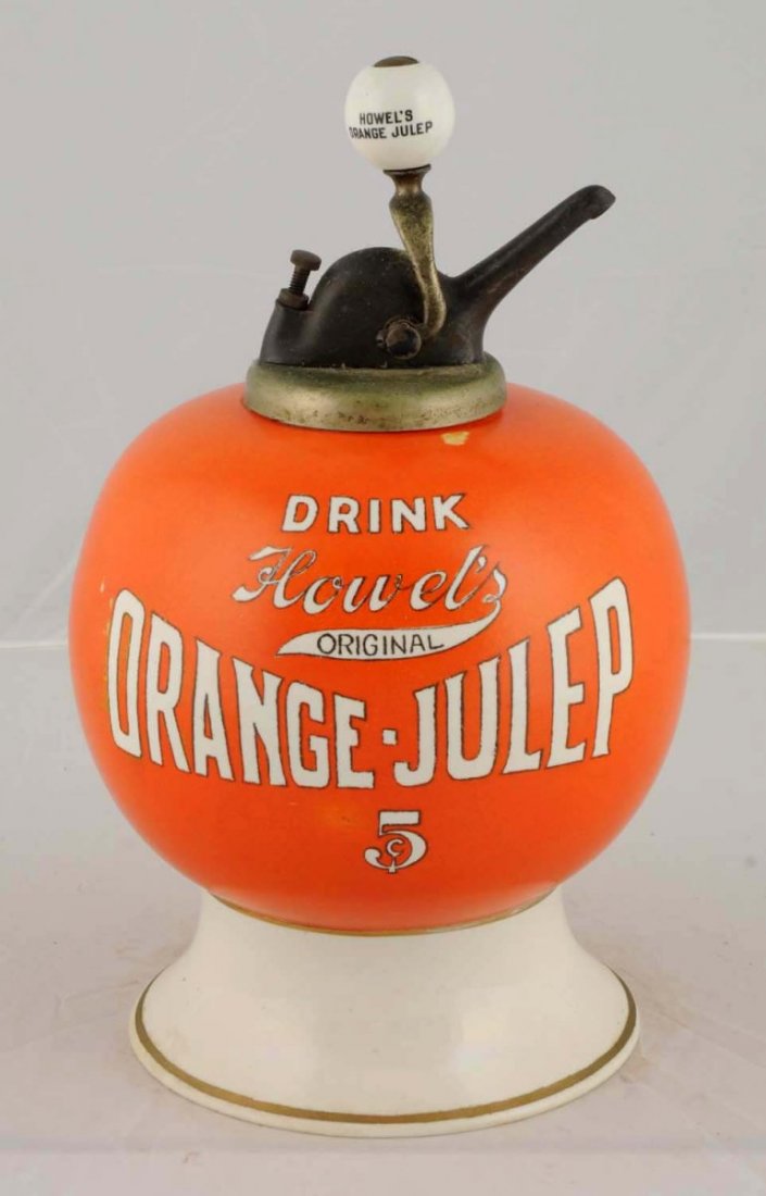 Howell's Orange Julep Syrup Dispenser.: Ceramic, C.1900. Ball shaped, original pump with Howell's Orange Julep on it. Condition (Near Mint). Size 15" T. CORRECTION: Base and inside of bottom piece has been repaired.