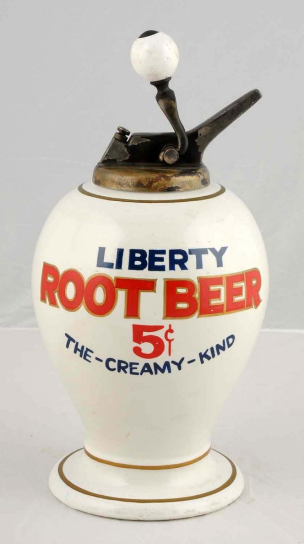 Liberty Root Beer Syrup Dispenser.: "The-Creamy-Kind", ceramic, fantasy dispenser, wit a ball style pump. The lettering on this dispenser has been touched up. Condition (Excellent). Size 14" T.