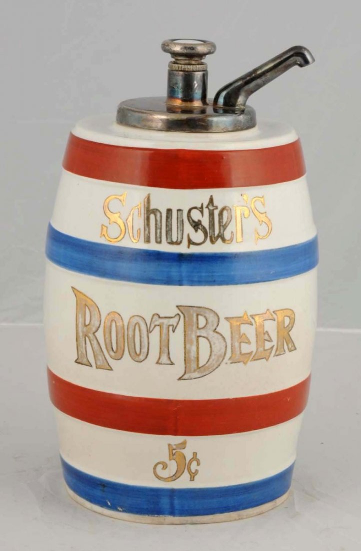 Schuster's Root Beer Syrup Dispenser.: Five cent red and blue stripes. Lettering on front and back. Ceramic, barrel shape. Original pump. C. 1920. Size 13 - 1/4" T.