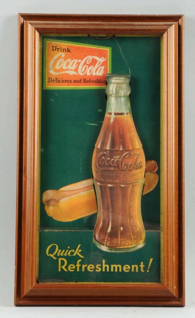 Framed 1931 Coca-Cola Hot Dog Sign.: Displays dimensionally and a harder variation to find. Some fading, soiling, rubs, and bends at edges. Two closed tears or bend lines above bottle. Condition (Good). Size Framed: 22 - 1/4" x 13".