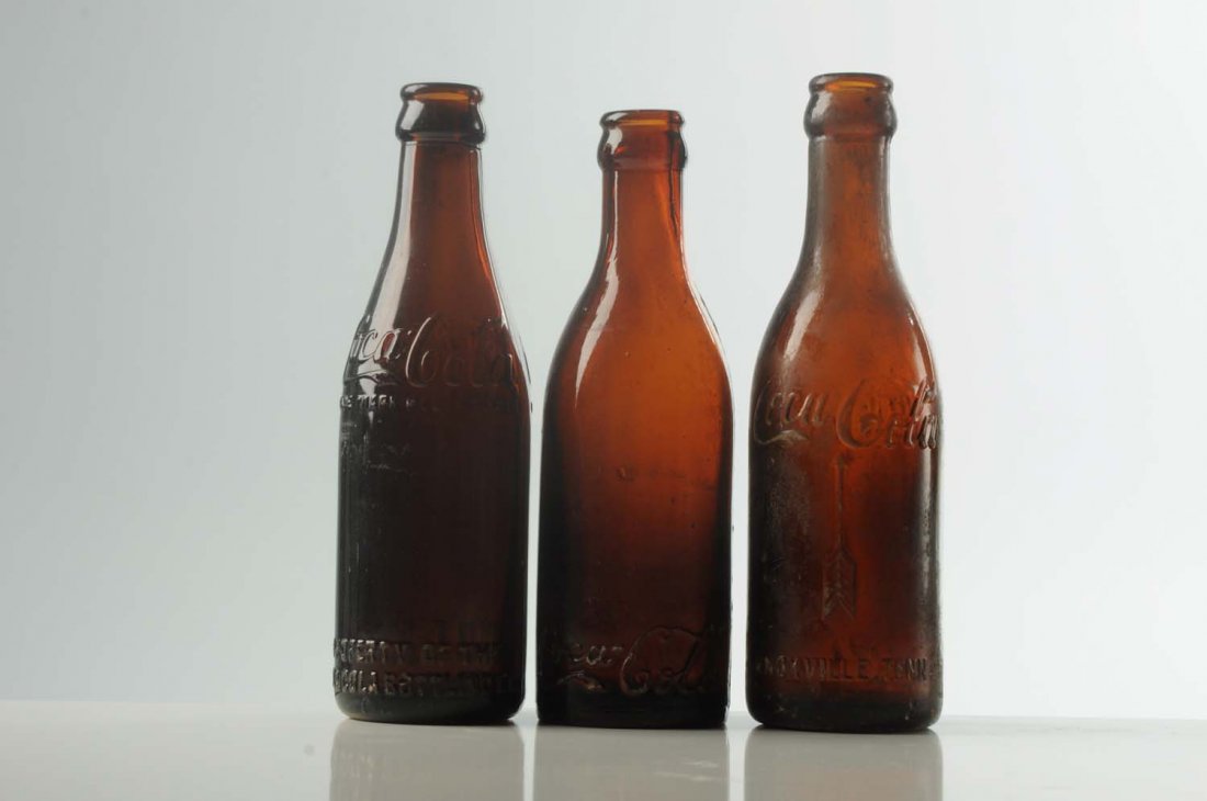 Lot of 3: Coca-Cola Bottles.: One from Knoxville, one from Nashville and one from Finlay, Ohio. All have small chips either on the base or on the lip. Condition (Very Good). Size Each: 7 - 3/4" T.