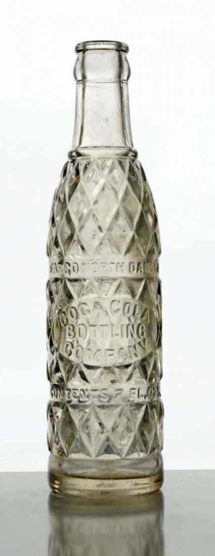 Coca-Cola Fargo, North Dakota Embossed Bottle.: 1920's-30's. 7oz. clear with light interior soiling and four - five small nicks. Condition (Excellent). Size 8 - 1/2" T.
