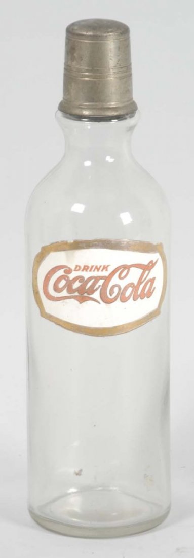 Early Fired Enamel Label Coca-Cola Syrup Bottle.: Cap appears to be totally original to this bottle. With light soiling and tarnish, this bottle is wonderfully strong, with great color remaining. Only some very minor stains or smudges appear on the l
