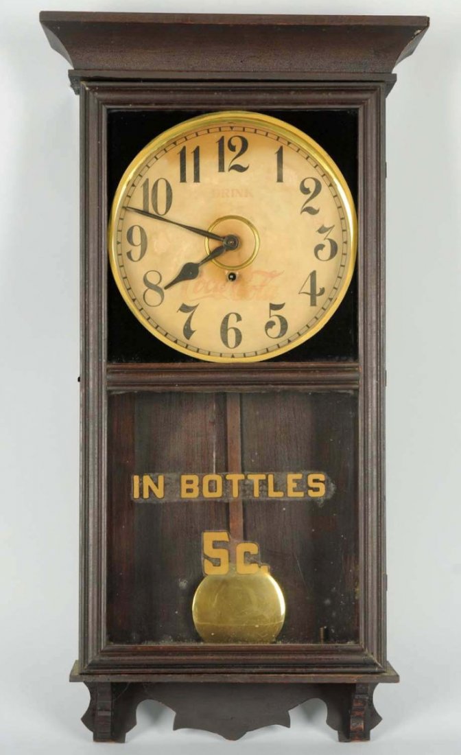 Early Coca-Cola Wooden Regulator Clock.: By Gilbert. Soiling with overall wear. Appears to be completely original with bottom glass and original finish. Condition (Very Good). Size 34 - 1/4" T.