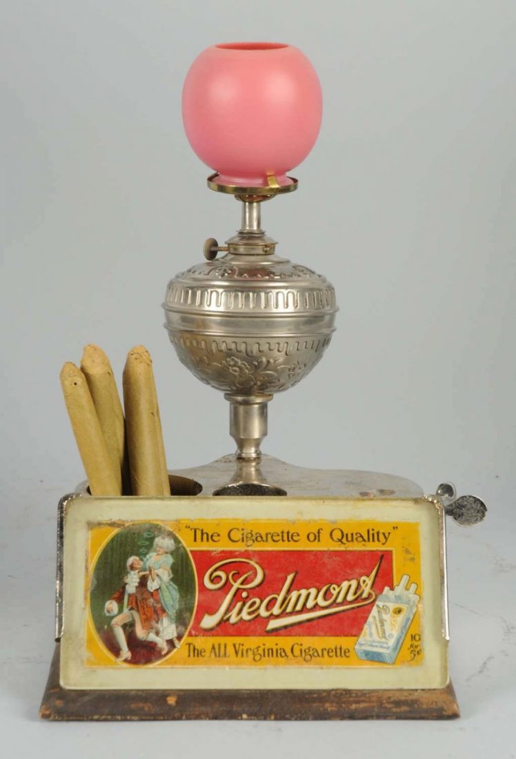 Piedmont Cigar Cutter & Lighter.: Has pink glass globe, holds cigars, glass advertising on front. C.1890. Size 13" T.