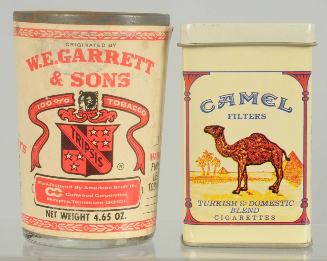 Lot of 2: Tobacco Items.: Includes a glass jar of WE Garret Sons Scotch Snuff and a new flip top Camel tin. Condition (Excellent). Size Largest: 4" T.