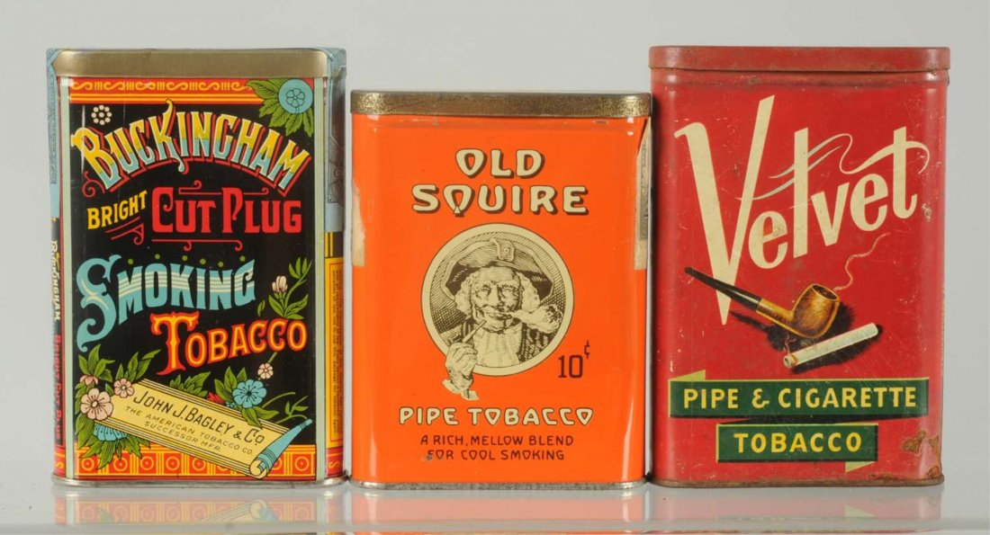 Lot of 3: Vertical Pocket Tobacco Tins.: Includes an unopened Buckingham, an Old Squire with very little overall wear. Also a Velvet with some modest wear and light oxidation. Condition (Very Good - Excellent). Size Largest: 4 - 1/2" T.