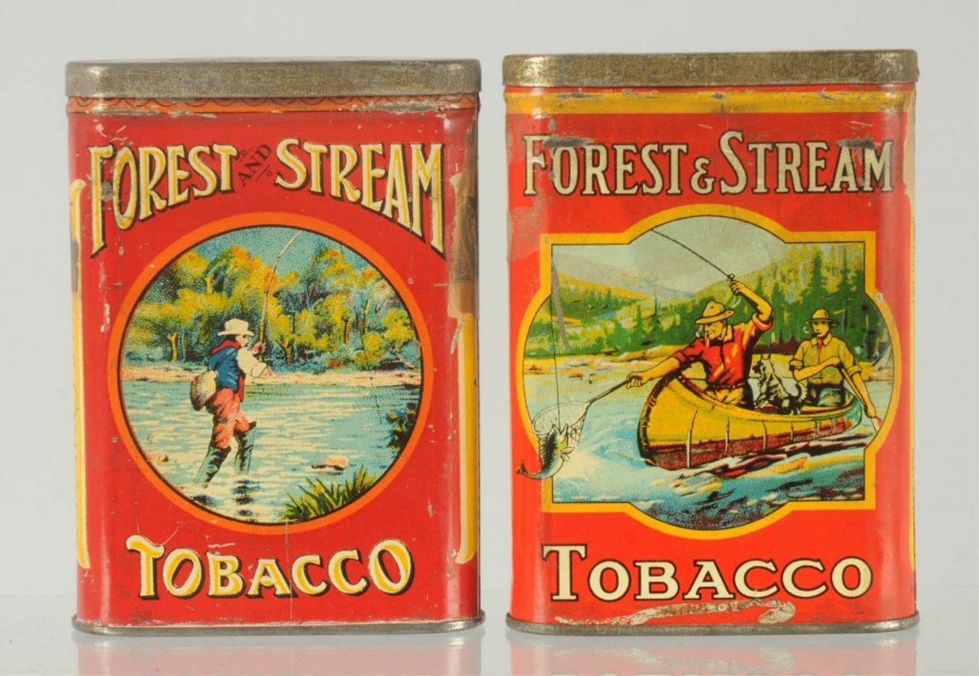Lot of 2: Forest & Stream Vertical Tobacco Tins.: Includes Man with Creel version and the Canoe version. Both are genuinely nice. Scattered overall wear. Nothing too serious. Condition (Very Good). Size Each: 4 - 1/4" T.