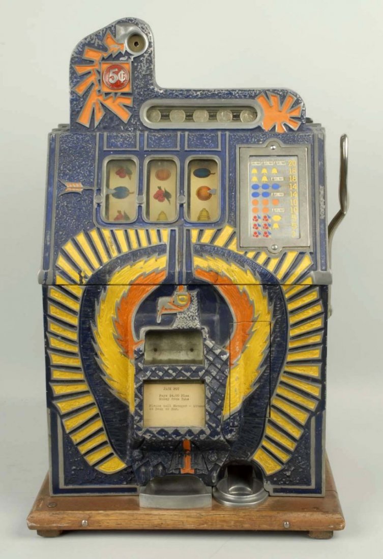 Mills War Eagle 5¢ Slot Machine.: Older repaint. Paper wood grain liners cover both sides of case. Plays and pays correctly. Comes with extra Mills reel bundle. Condition (Good).