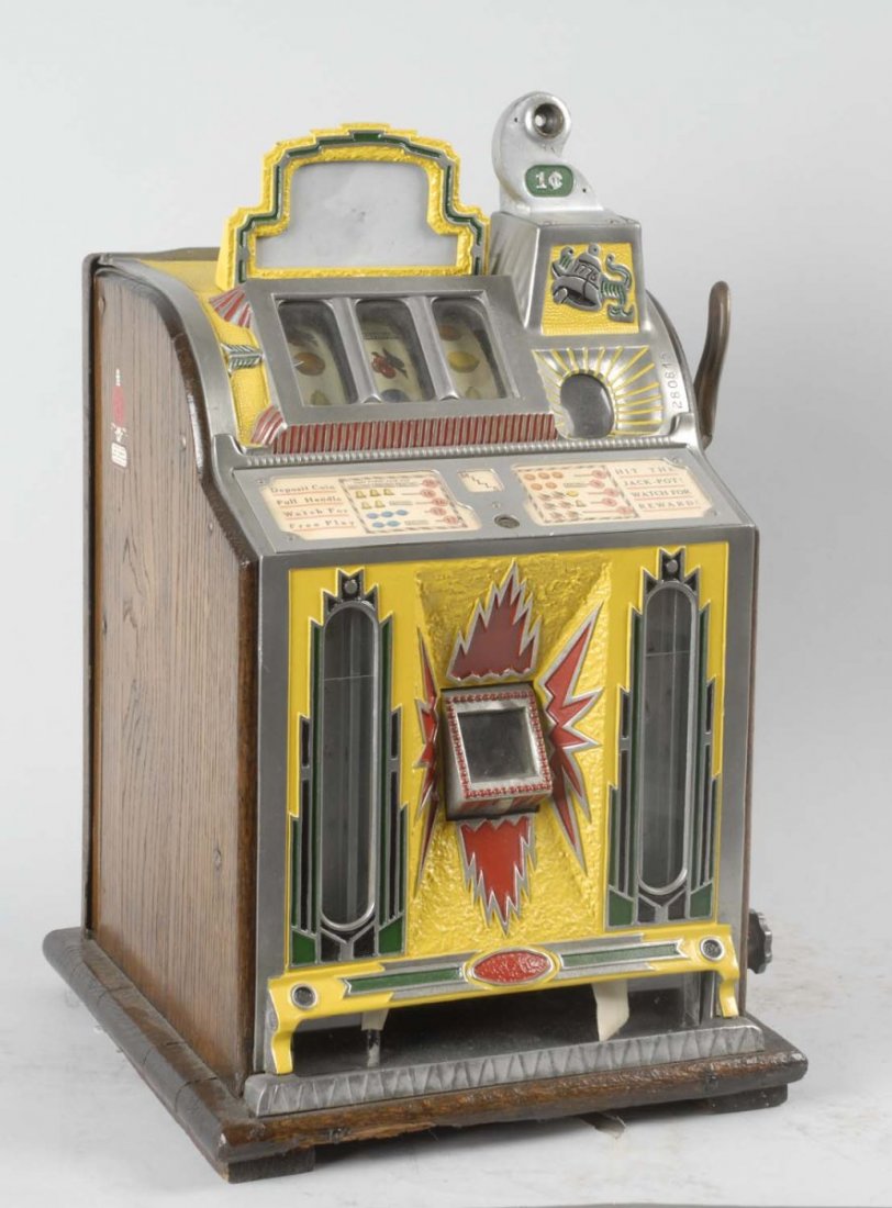 Mills FOK 1¢ Slot Machine.: With gum ball vending front. Old restoration. Corrosion on metal casting and mechanism. Plays and pays correctly. Original locks. Non-working front lock with no key. Condition (Fair). Size 27" T.