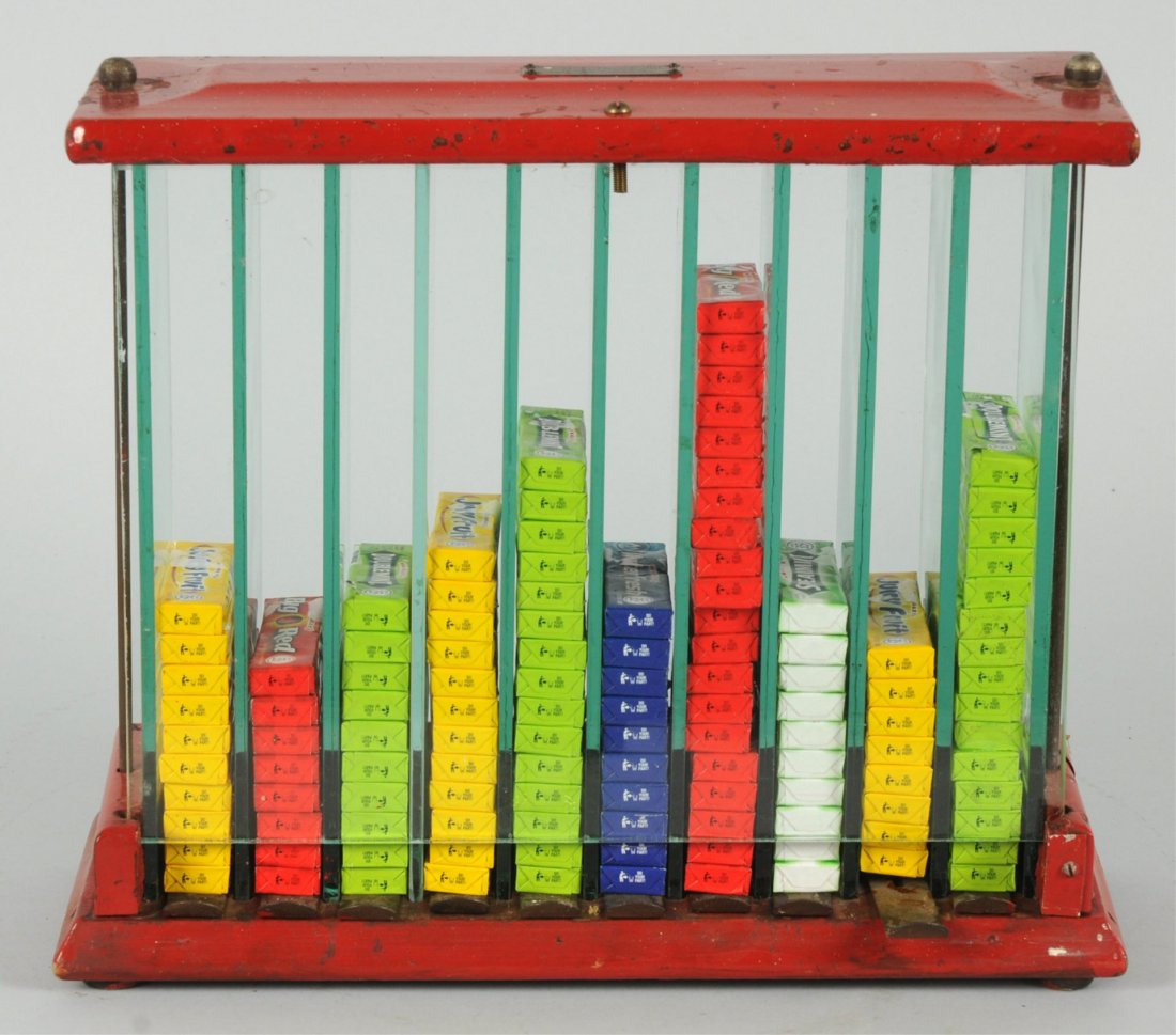 Gum Display Case.: Wood and glass. Manufactured by Ft. Scott Planing Mill in Kansas. Metal pull levers at bottom dispensed one pack of gum at a time. One minor split at base. Dated 1921. Condition (Very Good). Size 14" 