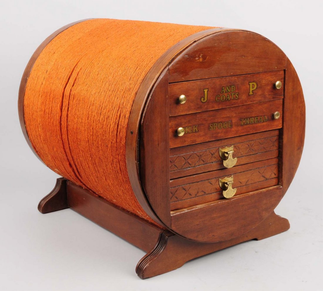J & P Coats Spool Cabinet.: Figural in shape of a oversize thread spool, has sliding drawers in the end. Size 22" L.